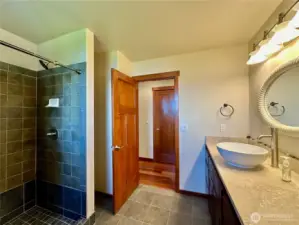A separate suite/4th bedroom with a large living space, sleeping quarters and ¾ bathroom.