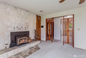 Another view looking from living room into entry and dining room