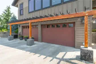Attached two-car garage with the left bay converted into a spacious bonus room—perfect for entertaining or hosting guests.