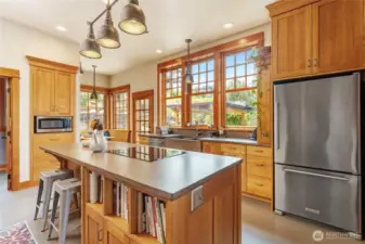 Expansive kitchen featuring abundant workspace and impeccable custom cabinetry craftsmanship.