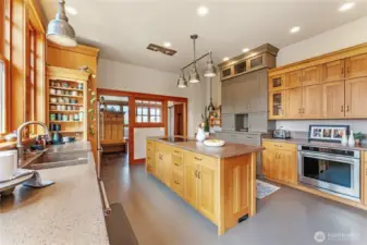 The kitchen is exceptionally spacious—offering room to cook, gather, and even dance.