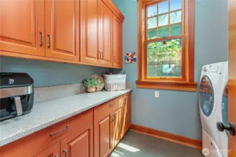 Butler’s pantry and utility room located just off the kitchen—fully equipped for seamless organization and daily convenience.