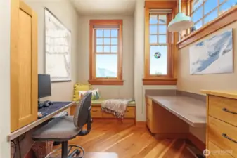 The office features a cozy window seat—perfect for reading, relaxing, or quiet contemplation.