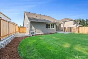 Backyard patio is perfect for those summer BBQs and easy access to front yard through side gate.