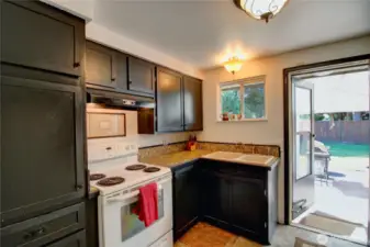 Enter backyard patio through the kitchen.