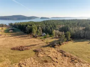 Thoughtfully positioned, the home overlooks open fields protected by a conservation easement.