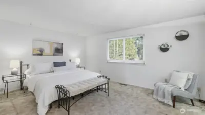 A peaceful primary retreat with soft natural light and a calming atmosphere