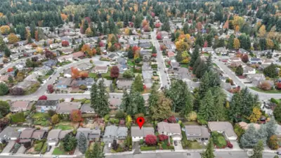 Aerial perspective highlighting the home’s prime location within a quiet residential community