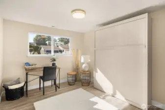 Built-in Murphy bed folds up easily to create flexible space and stays with the home.