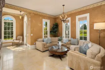 Sitting room or music room adjacent to living room. Fortuny ceiling lamps and antique fixtures glimmer throughout home.