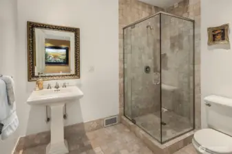 Second floor 3/4 bathroom with pedestal sink and walk-in shower.