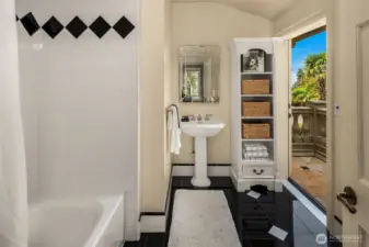 En-suite bathroom to fourth bedroom with balcony.