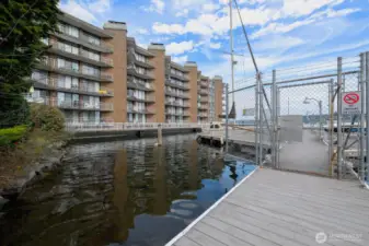 Spinnaker Bay’s waterfront setting is front and center—an ever-changing view of boats, reflections, and coastal sky just beyond your door.
