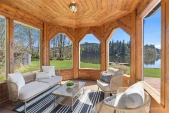 This lovely screened in porch is the perfect place to enjoy your morning cup of coffee.