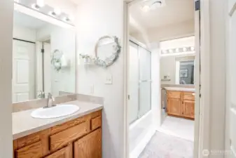 Primary bedroom has a private sink/vanity and access to the full bathroom.