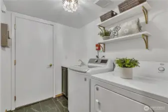 Main level utility room with access to 2 car garage.