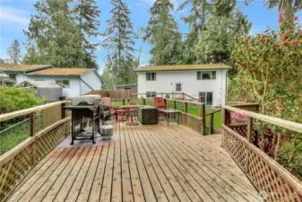 Large deck overlooking the back of the property