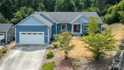 Welcome home to this beautiful one level home in a private setting on over half an acre!