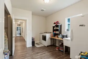 Huge laundry room with soaking tub, Tons of storage.  This house doesn't lack storage!