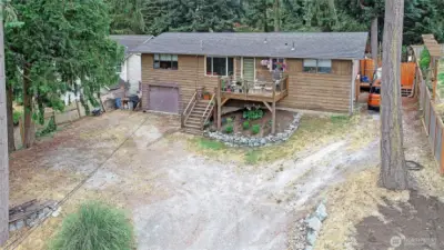Aerial view of the home perched up on a hill with territorial views