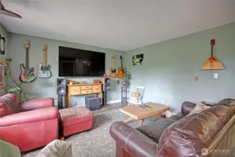 Front living room is naturally bright and spacious.