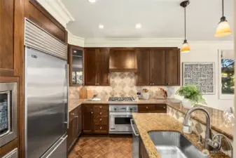 Handsome kitchen with granite & stainless appliances.