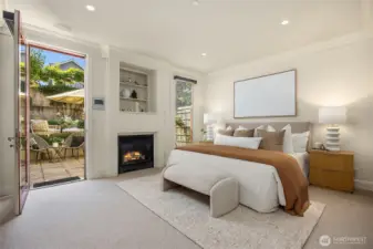 Primary suite has a gas fireplace and access to the intimate back patio.