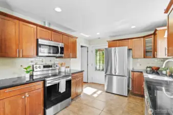 Easy access to backyard and the 3rd bedroom is located just off to the left... also works as an office.
