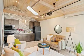 Enjoy a full kitchen, vaulted ceilings, skylight, and ceramic tile floors.