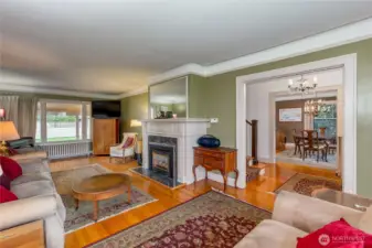 Large living room to left of entrance.  Beautiful hardwood floor and cozy gas fireplace.