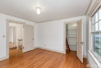 NE bedroom offers access to attic area.