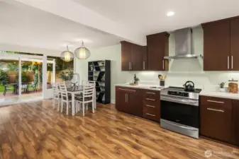 Spacious dining area with double sided wood burning fireplace.