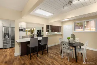 Large counter seating on both sides with storage below.