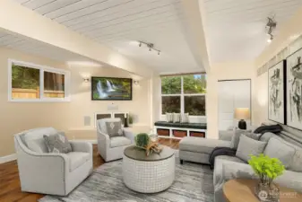 A remote controlled window shade is located over the window seat.