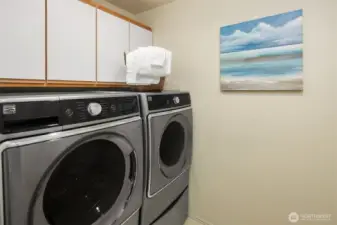 Laundry with oversized washer and dryer-fits King sized comforters. The second smaller washer bin (below) for delicates or hand washables.