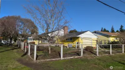 Corner Lot has large front yard & room for parking