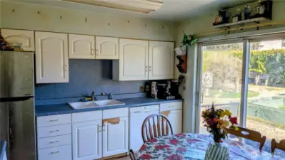 Kitchen with sliding glass doors to huge backyard space