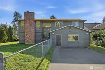 Warm and welcoming street presence on an oversized lot in a prime, convenient location.