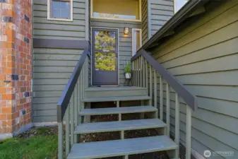 Welcoming front entry with elevated approach and pleasant sense of arrival.