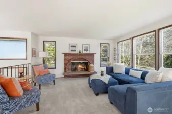 Unique window design adds warmth, light, and personality to the living area.