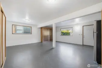 Converted garage space offering excellent flexibility for a home office, workout room, or play area, with separate entrance.