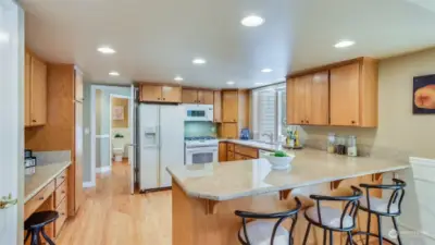 You will love entertaining in this kitchen with breakfast bar seating, granite counters and open sight lines to the living room and steps from family room.