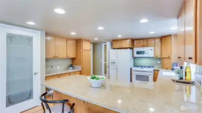 The kitchen provides tons of counter & cabinet space & pantry!