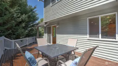 Extend your living to the back deck with tree-lined views. The deck wraps around and is a must see to appreciate the size! This deck is so spacious and waiting for all your summer gatherings!