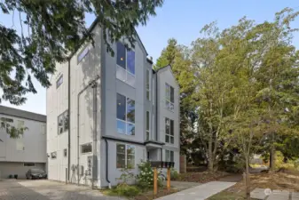 Modern and sleek, this stylish home stands tall with large windows that flood the interior with natural light.