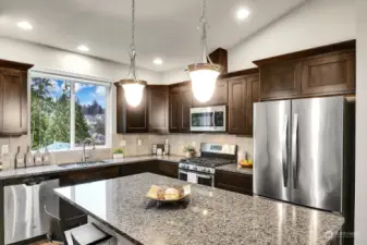 Additionally, the kitchen features a good sized central island with storage.