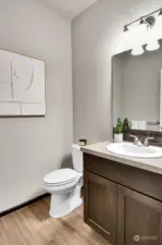 A convenient half-bath is also located on the upper level.