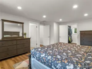 Primary bedroom with walk-in closet and ensuite bathroom.