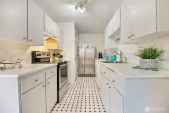 Newer stainless steel refrigerator and stove.