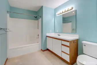 Spacious bathroom with a full-size tub/shower combo and great vanity storage for all your daily needs.